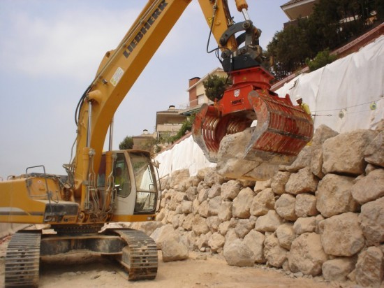 NPK DG-30 demolition & sorting grab, moving large boulders to control erosion